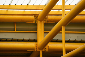 Modern Translucent Roof Structure with Yellow Steel Beams