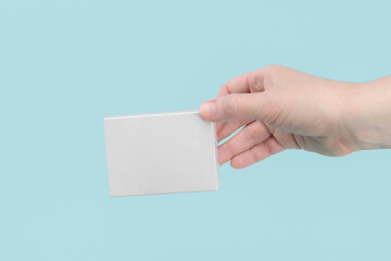 Blank White Product Package Box Mock-up. In a female hand. Container, Packaging Template on white .White cardboard box.