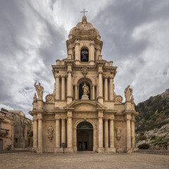 Fototapeta premium Majestic Church of Saint Bartholomew Stands Under a Dramatic Sicilian Sky in Scicli, Italy