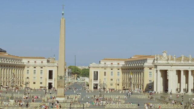 Vatican city, Rome, Italy - August 1 2024. Crowds of people stroll through St. Peter's Square, enjoying the lively atmosphere