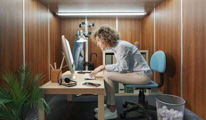 Woman working in a tiny office