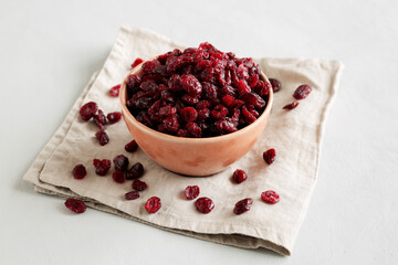 Organic Dried Cranberries in a Bowl, side view.