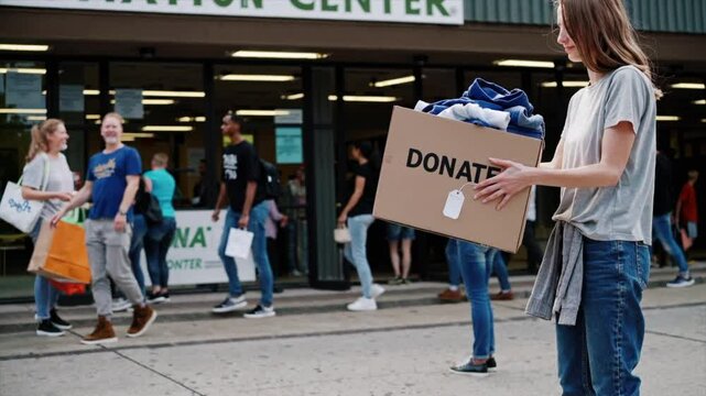 Community members gather to donate clothes at local donation center on busy day