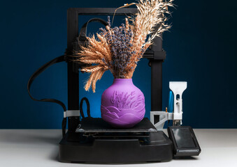 3D printer and finished product, advertising photo printing objects. Modern technical 3D printing, copy space.