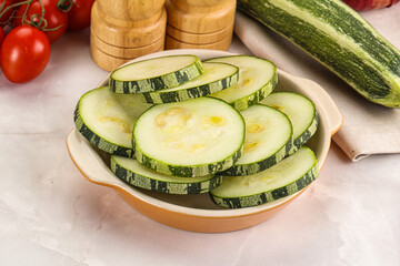Raw green zucchini slices for cooking