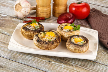 Baked champignon with quail egg
