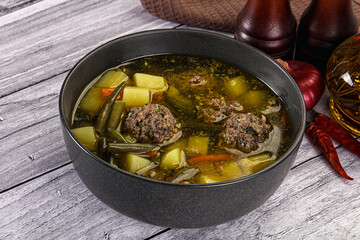 Soup with beef meatballs and vegetables