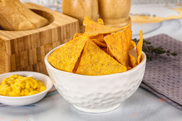 Corn nachos chips with cheese dip