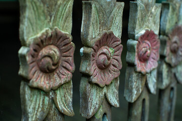 Banjar tribe wood carving with flower pattern, used for traditional staircase railing