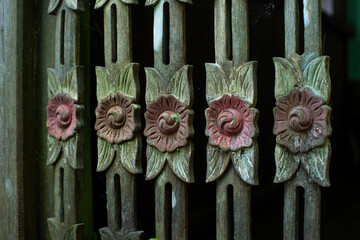 Banjar tribe wood carving with flower pattern, used for traditional staircase railing
