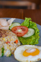 Indonesian fried rice, captured on May 6, 2025. A flavorful stir-fried rice dish with sweet soy sauce, garlic, chili, and traditional spices, served with egg and savory side dishes