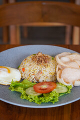 Indonesian fried rice, captured on May 6, 2025. A flavorful stir-fried rice dish with sweet soy sauce, garlic, chili, and traditional spices, served with egg and savory side dishes