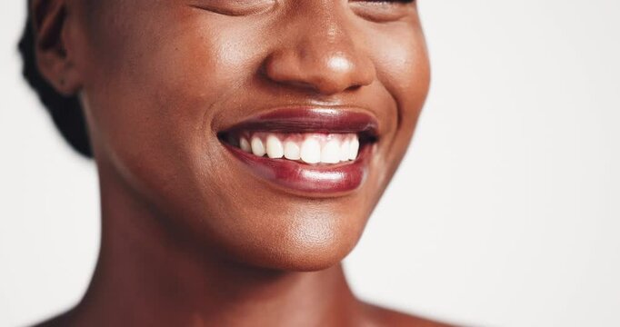 Smile, color and lipstick for lips, woman and cosmetics for beauty on mouth, studio and aesthetic. White background, model and enhancing appearance with makeup, moisturizing or prevention of dry skin