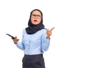 Portrait of shocked young Asian woman using a mobile phone and pointing fingers at copy space isolated on transparent background