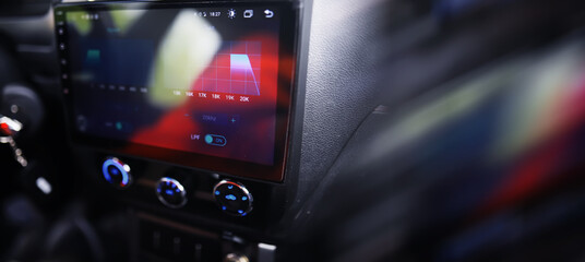 Fototapeta premium The process of choosing climate control in the car. Various controls in auto switches. Modern car interior