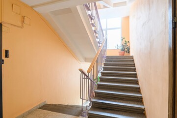 interior apartment public place, house entrance. doors, walls, staircase in a building, concrete...