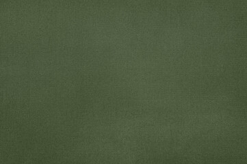 A close-up view of a green fabric's texture, showcasing the fine details and the material's subtle design.