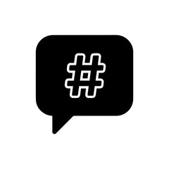 Fototapeta premium Black Filled Icon of Speech Bubble with Hashtag Symbol Inside Representing Social Media