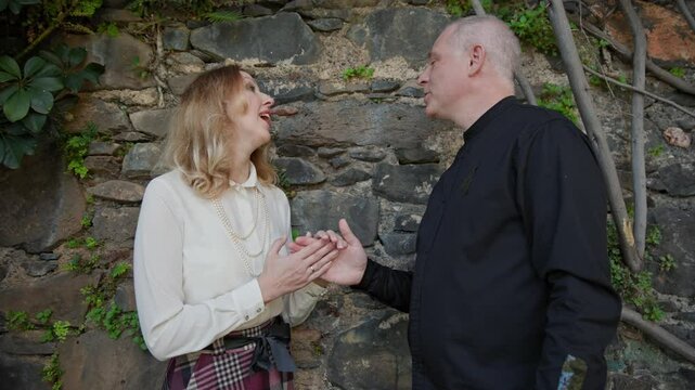 Couple holding hands and looking at each other in madeira