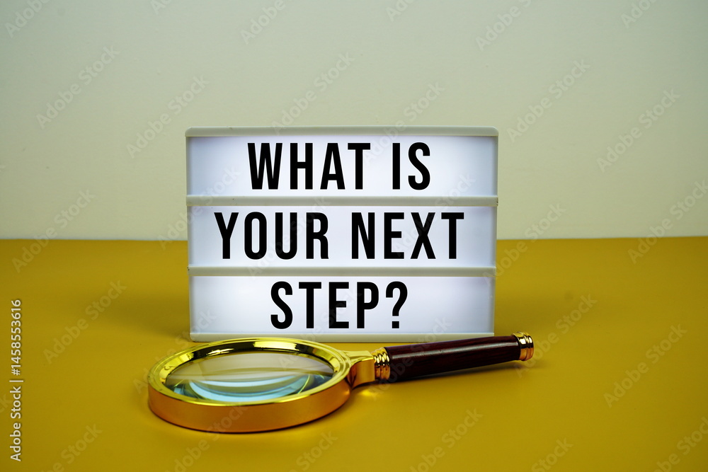 Poster what's your next step? text on light box with magnifying glass on yellow background