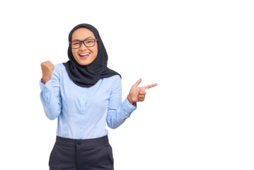 Portrait of smiling young Asian woman pointing fingers at copy space with victory gesture isolated on transparent background