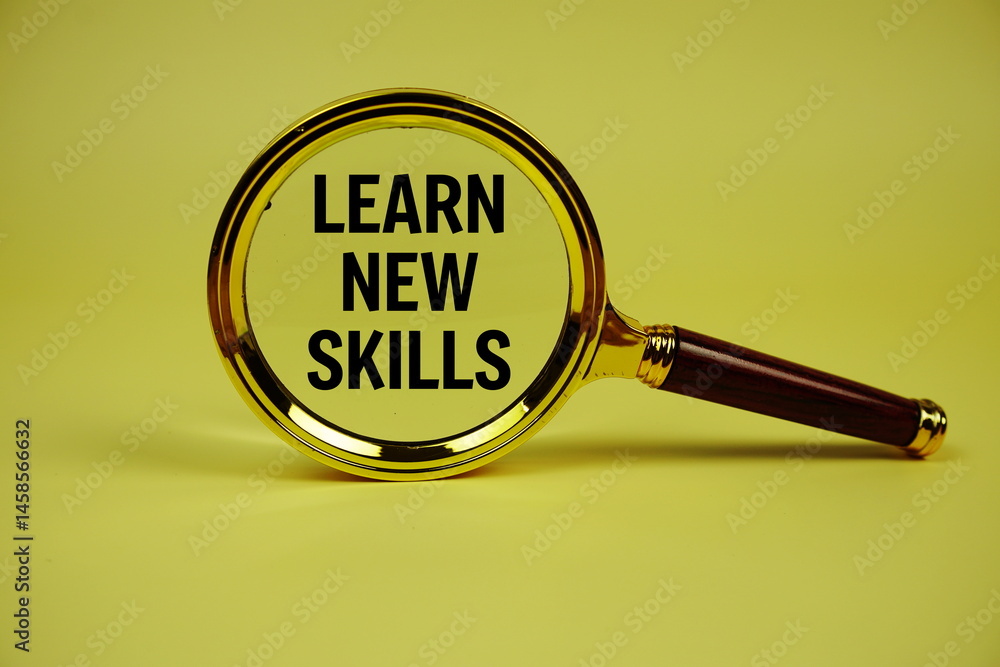 Aufkleber learn new skills text with magnifying glass on yellow background