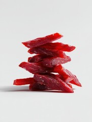 Stacked Slices of Dried Meat on a Light Background