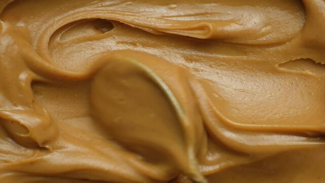 Detailed Peanut Butter Texture. Top View Slow Motion