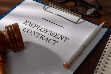 Corporate Desk Setup with Employment Contract and Legal Gavel