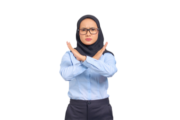 Portrait of annoyed young Asian woman crossing hands makes stop gesture, demonstrates rejection isolated on transparent background