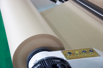 A roll of technical paper installed in the machine