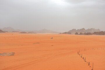Wadi Rum Desert, Jordan. The red desert and Jabal Al Qattar mountain. 8th July 2023. On a hot spring cloudy day. 