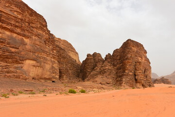 Wadi Rum Desert, Jordan. The red desert and Jabal Al Qattar mountain. 8th July 2023. On a hot spring cloudy day. 