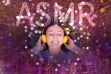 Autonomous sensory meridian response. Woman with headphones enjoying ASMR media on flowering...