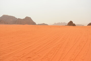 Wadi Rum Desert, Jordan. The red desert and Jabal Al Qattar mountain. 8th July 2023. On a hot spring cloudy day. 