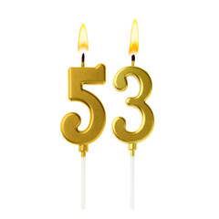 Burning golden cake candles composing number 53 on white background. Festive decoration for...