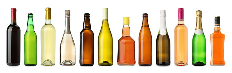 Bottles with different types of alcoholic drinks isolated on white, set