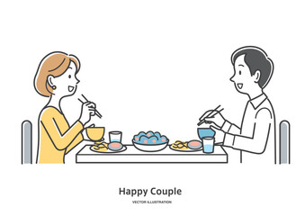 食事をする男女のカップル