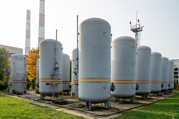 Large industrial tanks used for storing carbon dioxide at a facility. Connected pipes and valves...