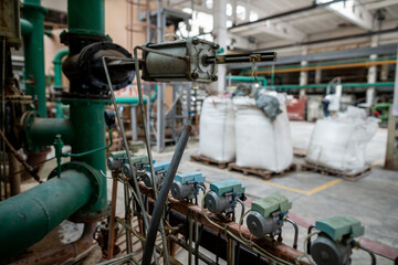 Archaic outdated system of water treatment area for a heat exchanger circuit, including purification units and bags of filtration materials such as sulfocarbon, cationite, ionite, and anionite.
