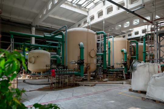 Archaic outdated system of water treatment area for a heat exchanger circuit, including purification units and bags of filtration materials such as sulfocarbon, cationite, ionite, and anionite.