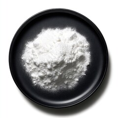 White flour in black bowl – culinary ingredient flat lay for baking blogs, recipe visuals, or food product branding