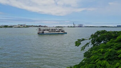 A cinematic video of a luxury metro boat carrying passengers at Kochi Water Metro Station