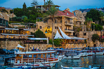 Historical houses and boats in the old port of Byblos, Lebanon