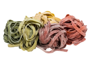 Colorful pasta variety.  A close-up of different colored pasta shapes, including green, yellow, and red, in a slightly messy pile