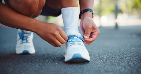 Sneakers, athlete and person with laces in street for fitness, exercise and ready for run outdoor....