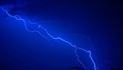 powerful blue lightning bolt strikes through dark stormy sky, creating dramatic and energizing scene filled with high contrast and intensity