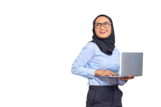 Portrait of smiling young Asian woman holding a laptop and looking away isolated on transparent background