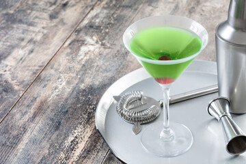 Japanese slipper cocktail on wooden table. Copy space