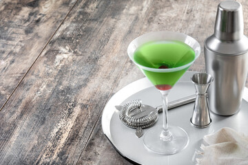 Japanese slipper cocktail on wooden table. Copy space